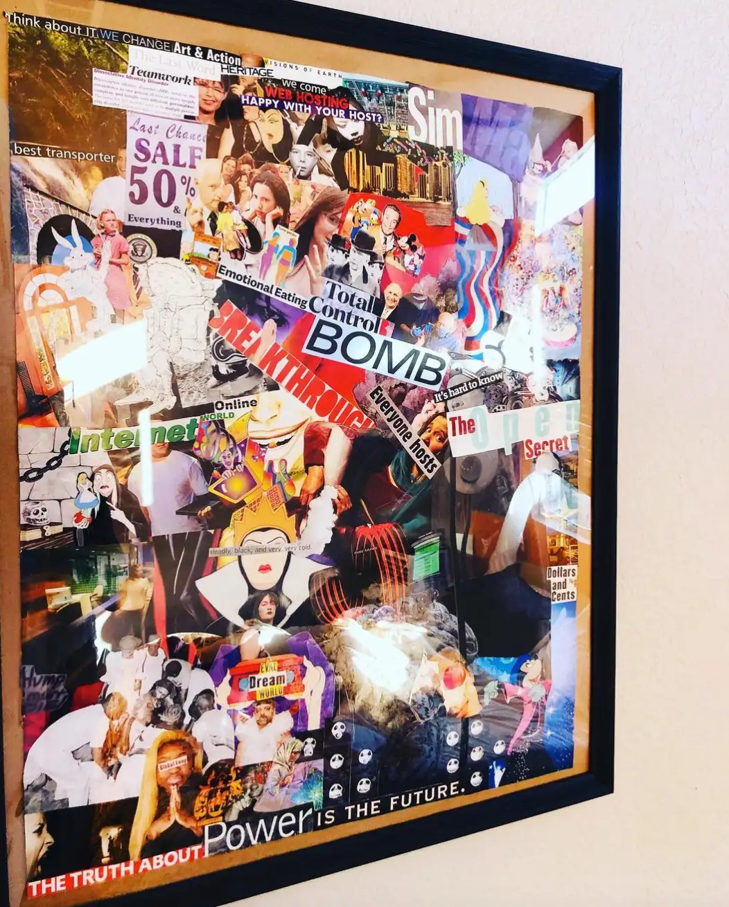 Framed collage of pop-culture cutouts, including the words “Bomb” and “Power is the future.”